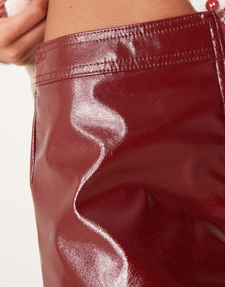 Zip front high shine leather look midi skirt in burgundy