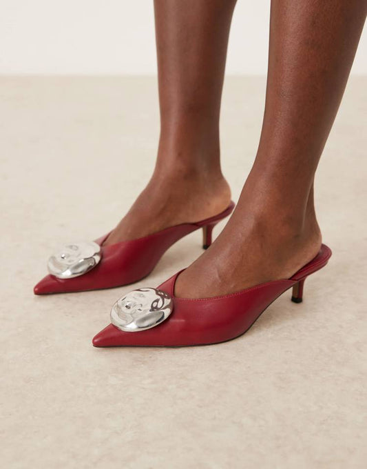 Surprise trim detail mid heeled mules in dark red