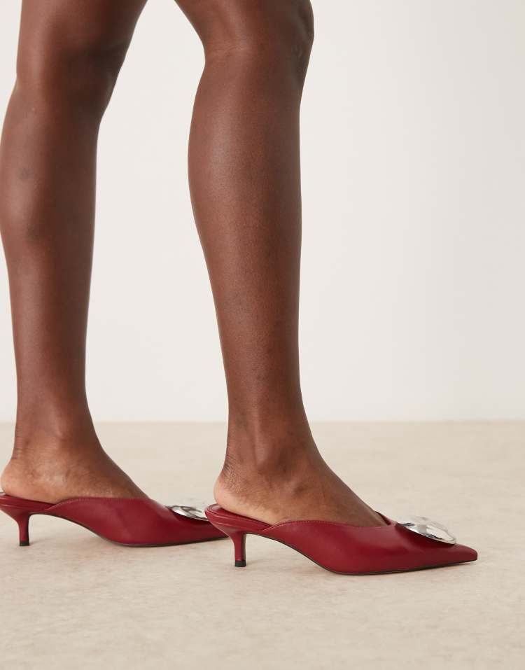 Surprise trim detail mid heeled mules in dark red