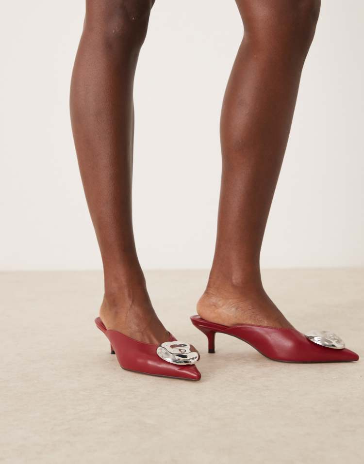 Surprise trim detail mid heeled mules in dark red