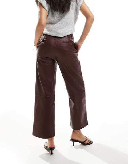 Faux leather ankle grazer trousers in dark cherry