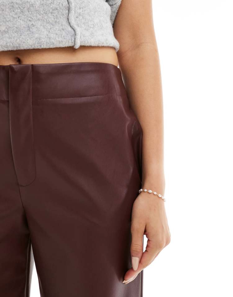 Faux leather ankle grazer trousers in dark cherry