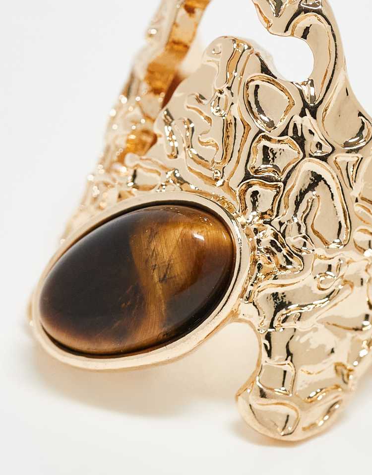 Wide textured ring with semi precious style stone set in gold tone