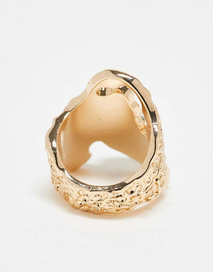 Wide textured ring with semi precious style stone set in gold tone