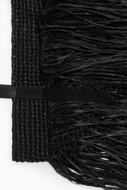 Fringed straw handbag