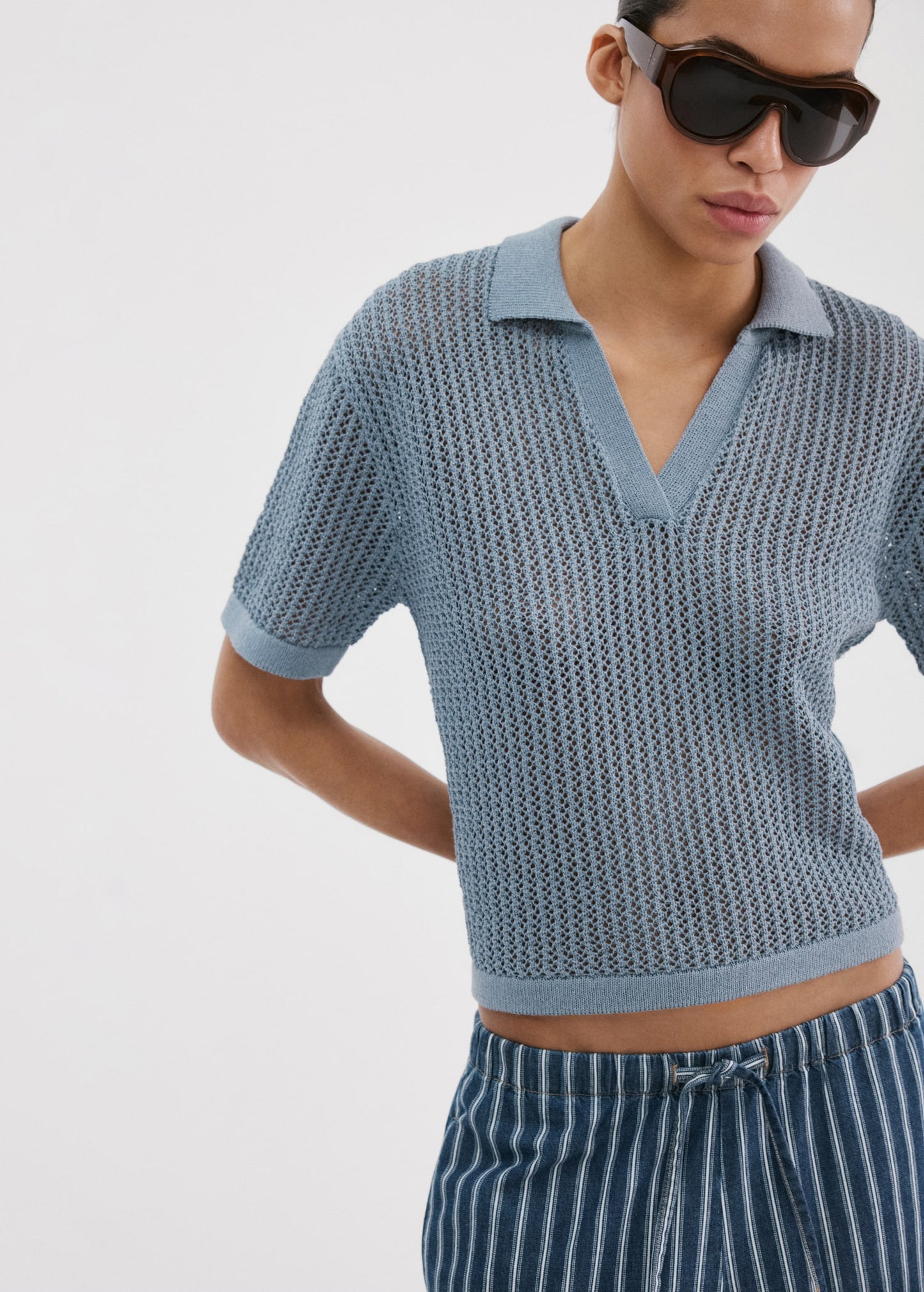 Openwork knitted polo-neck sweater