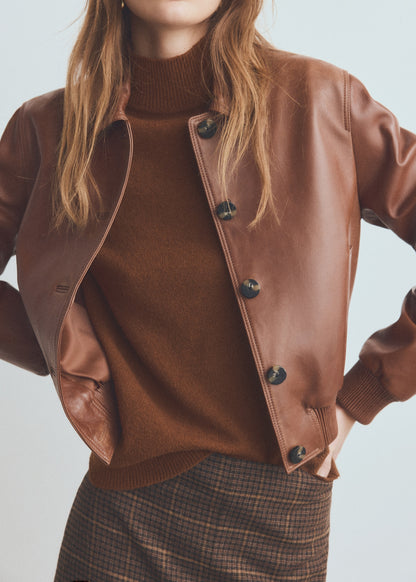 Sweater with buttoned cuffs and perkins collar