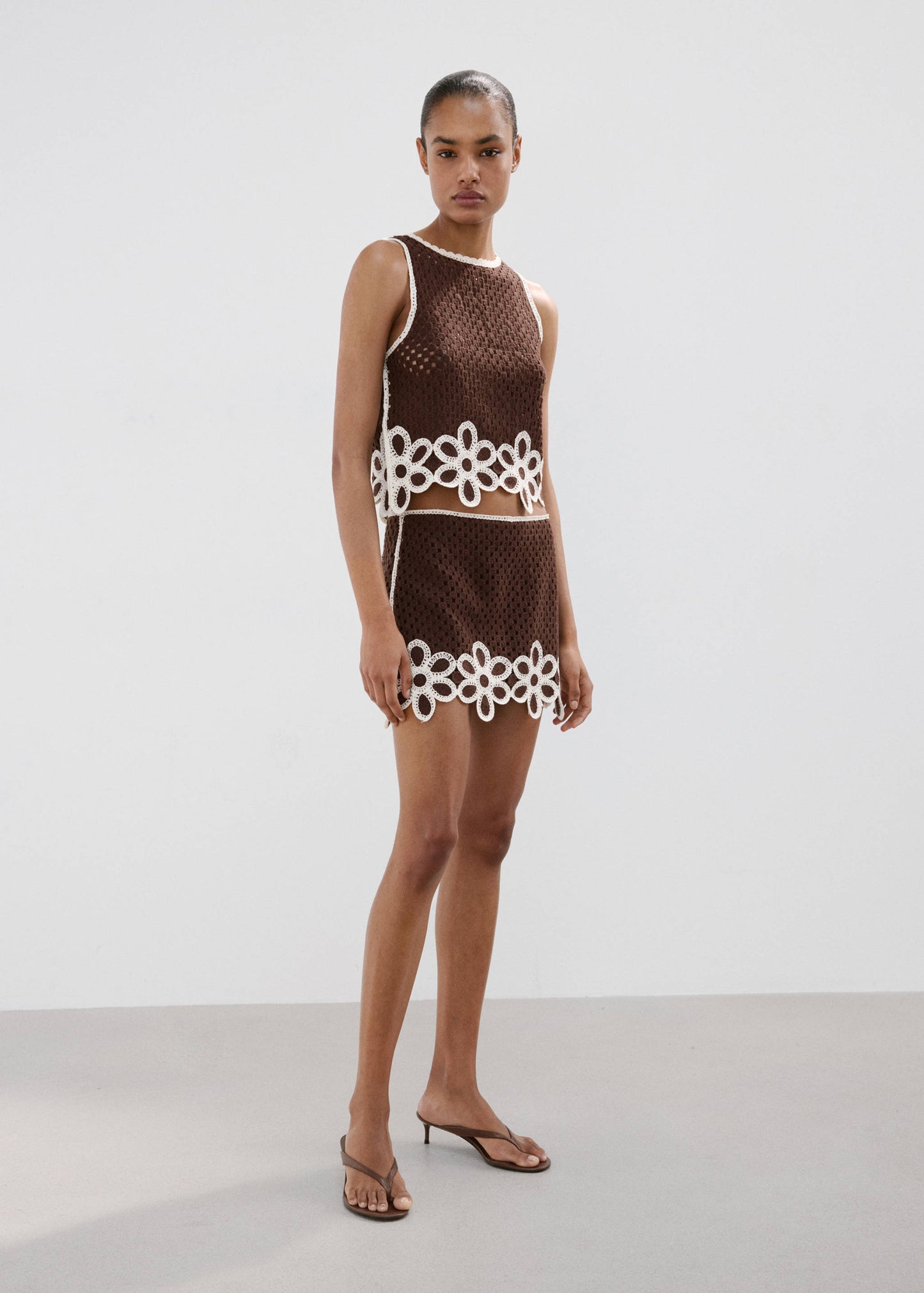 Floral-embroidered crochet top