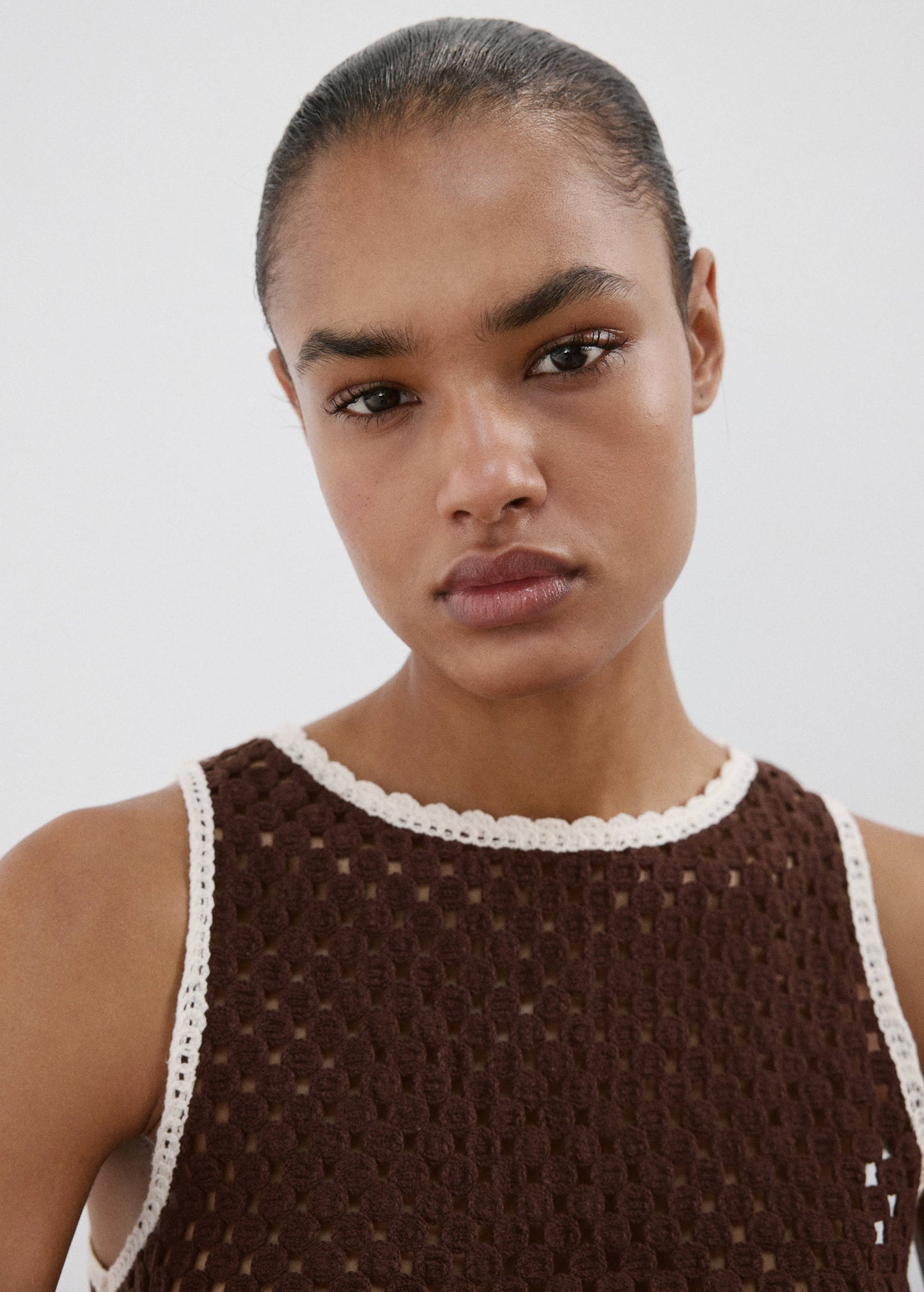 Floral-embroidered crochet top