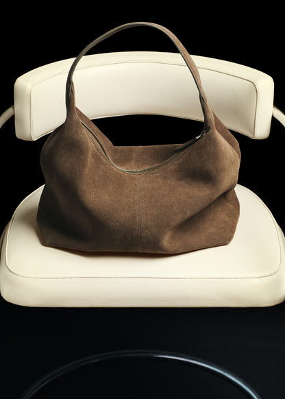 Suede shoulder bag with stitching