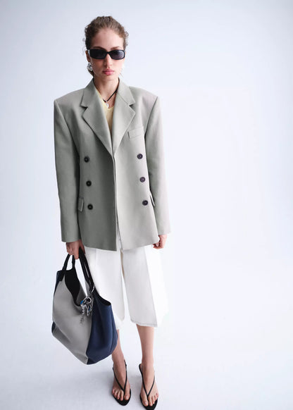 Double-breasted blazer with button closure