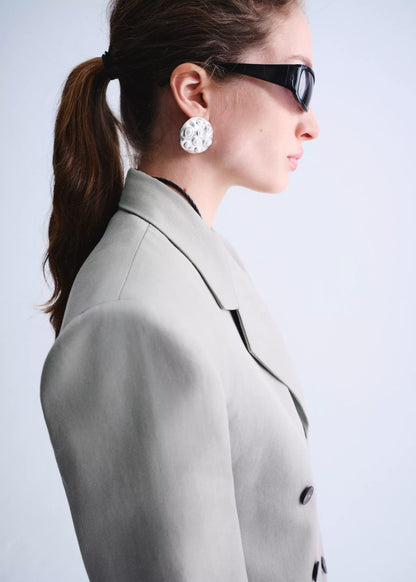Double-breasted blazer with button closure
