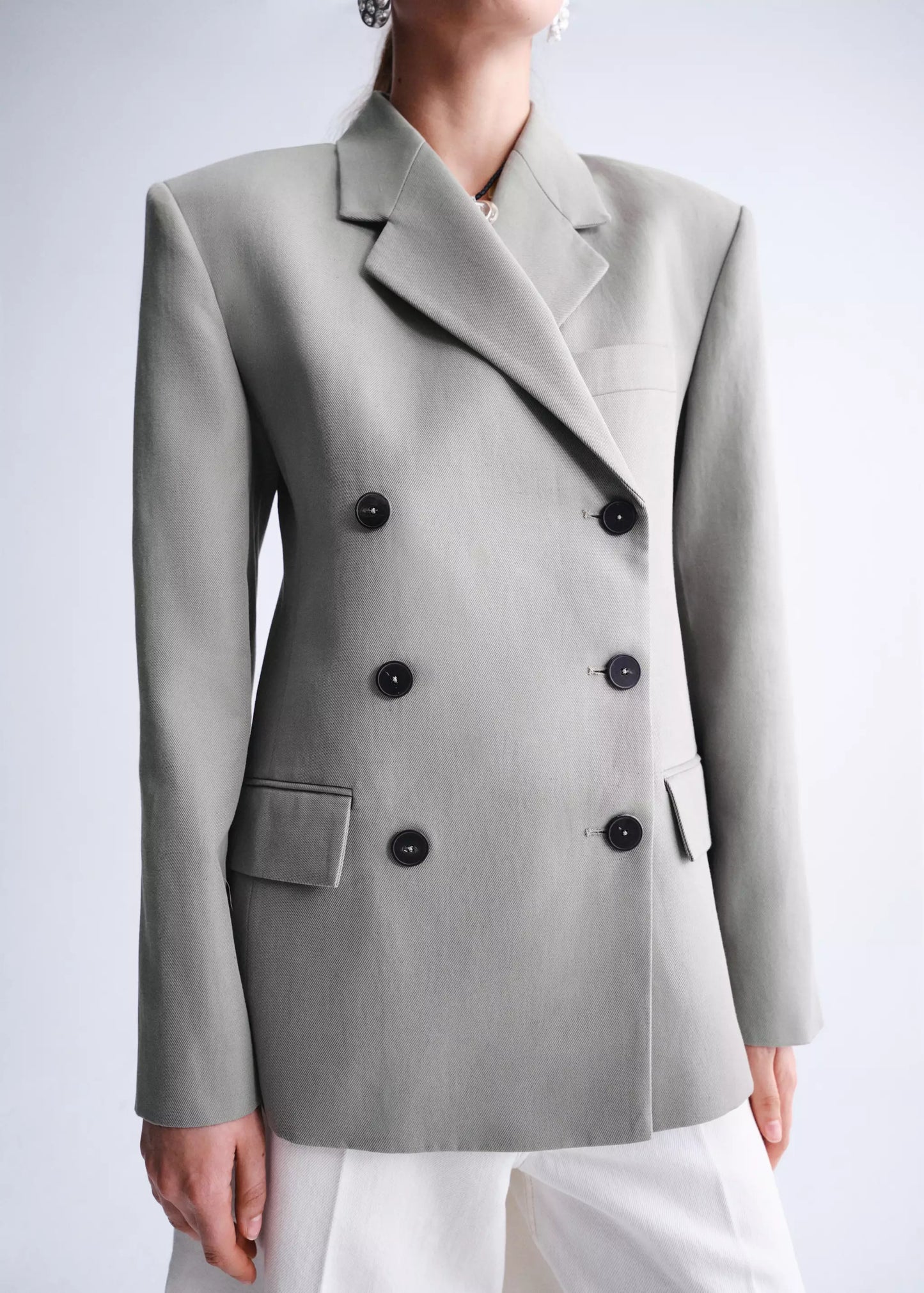 Double-breasted blazer with button closure