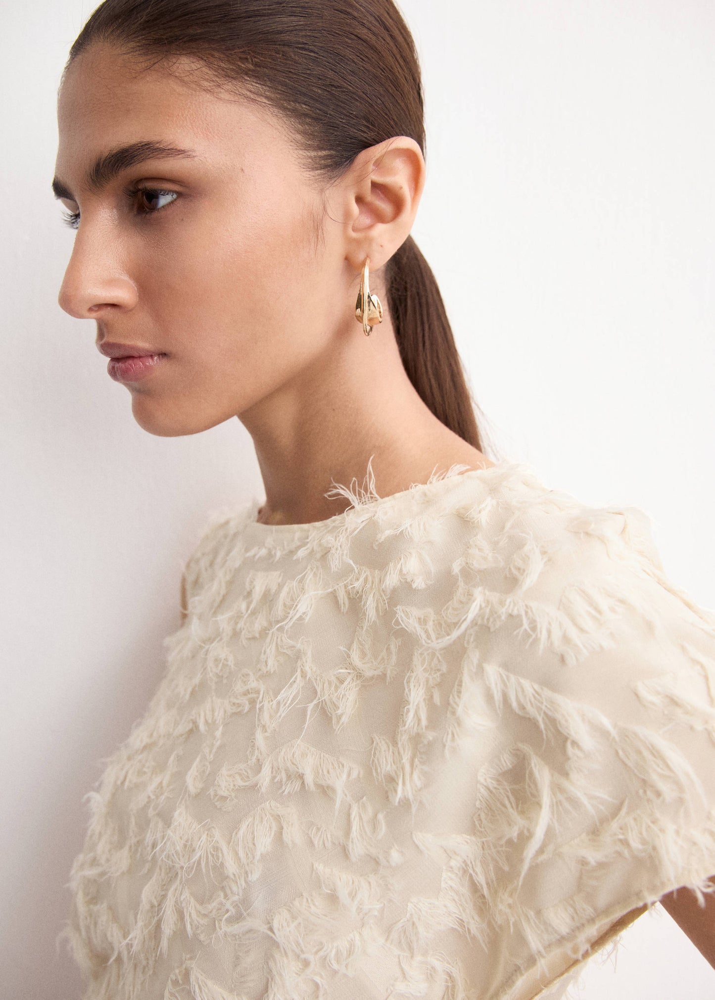 Asymmetrical textured top