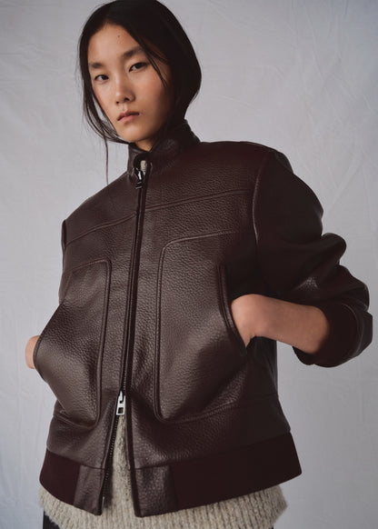 Collarless jacket with pockets