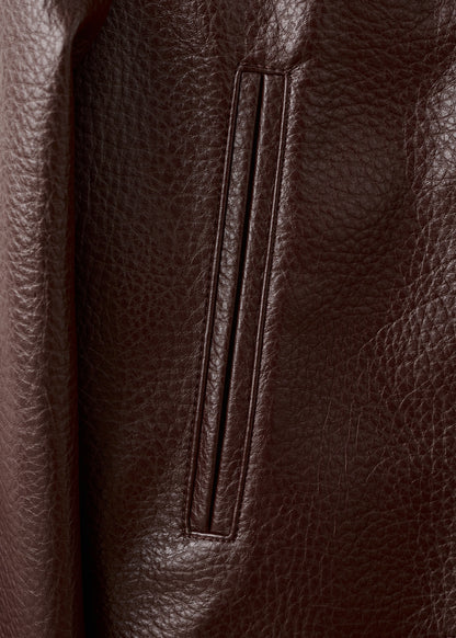 Collarless jacket with pockets