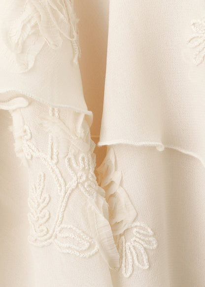 Ruffled blouse with bow neck