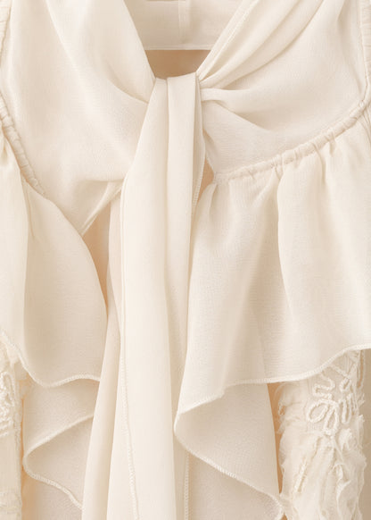Ruffled blouse with bow neck