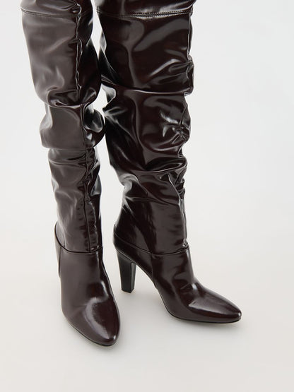 Draped over the knee midi heel boots