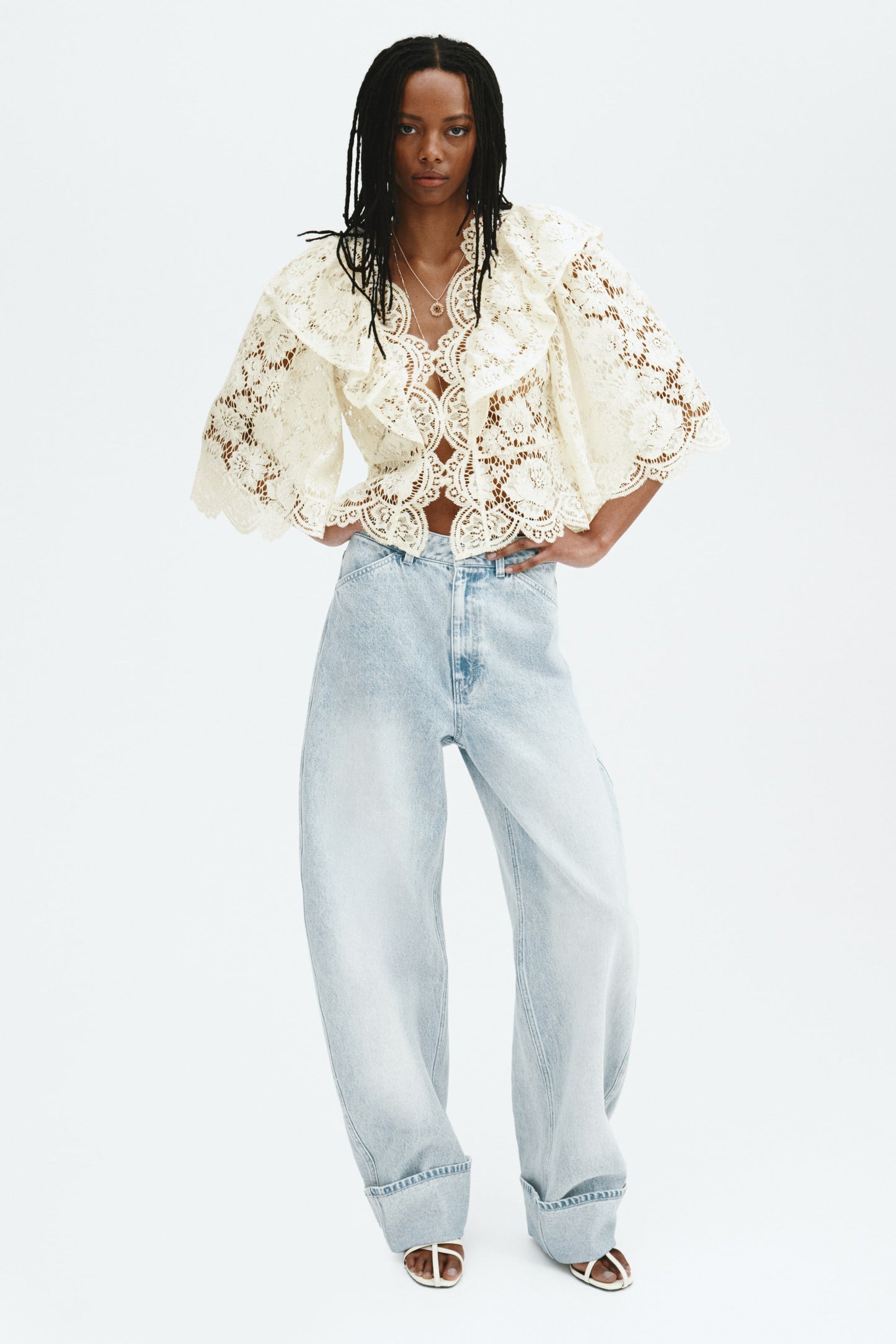 Flounce-trimmed lace blouse