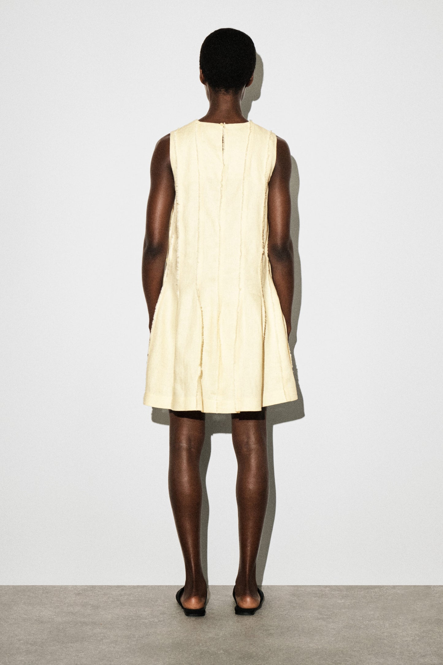 Sculpted pleated mini dress