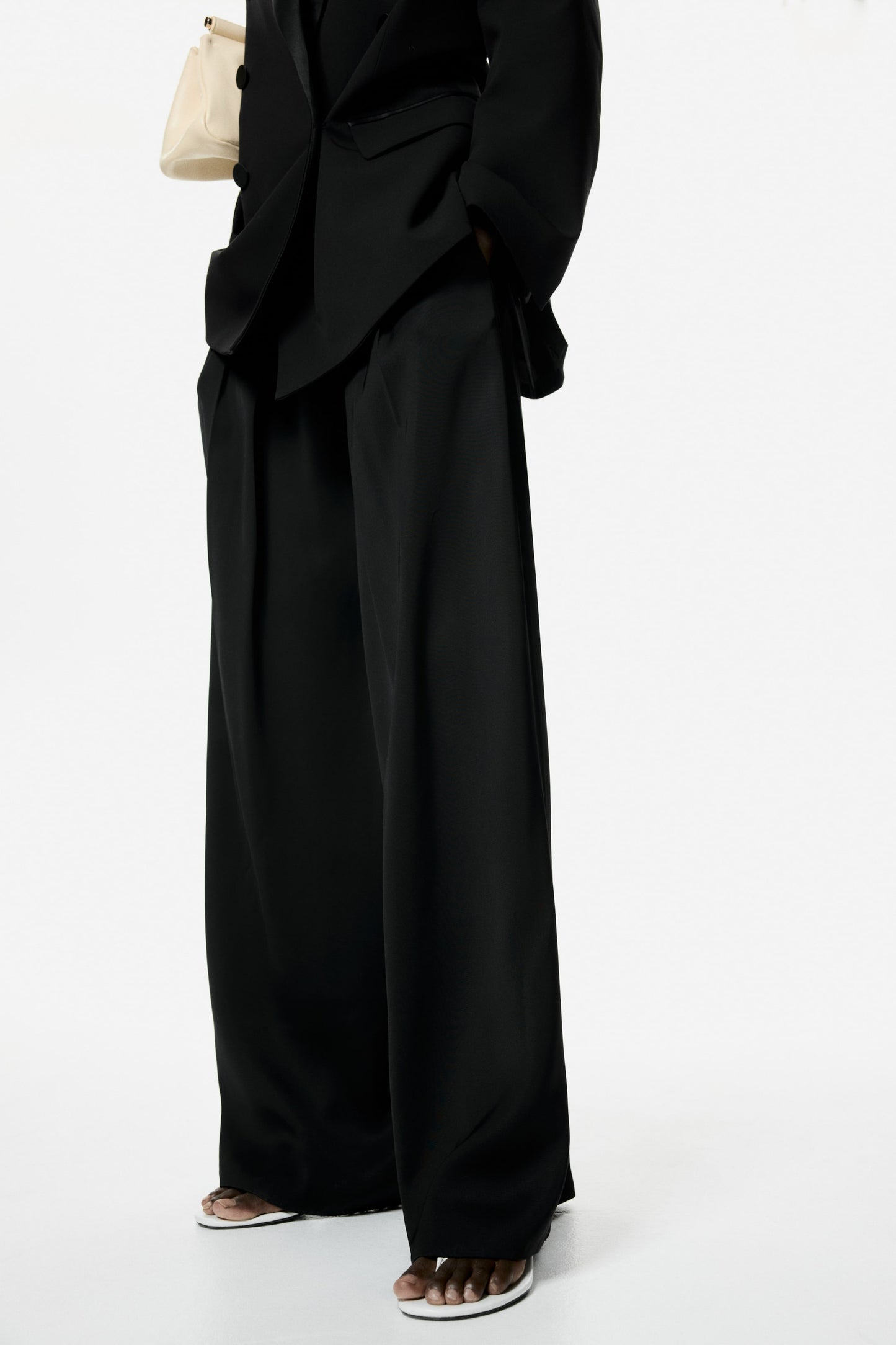 Belted pleat-detail trousers