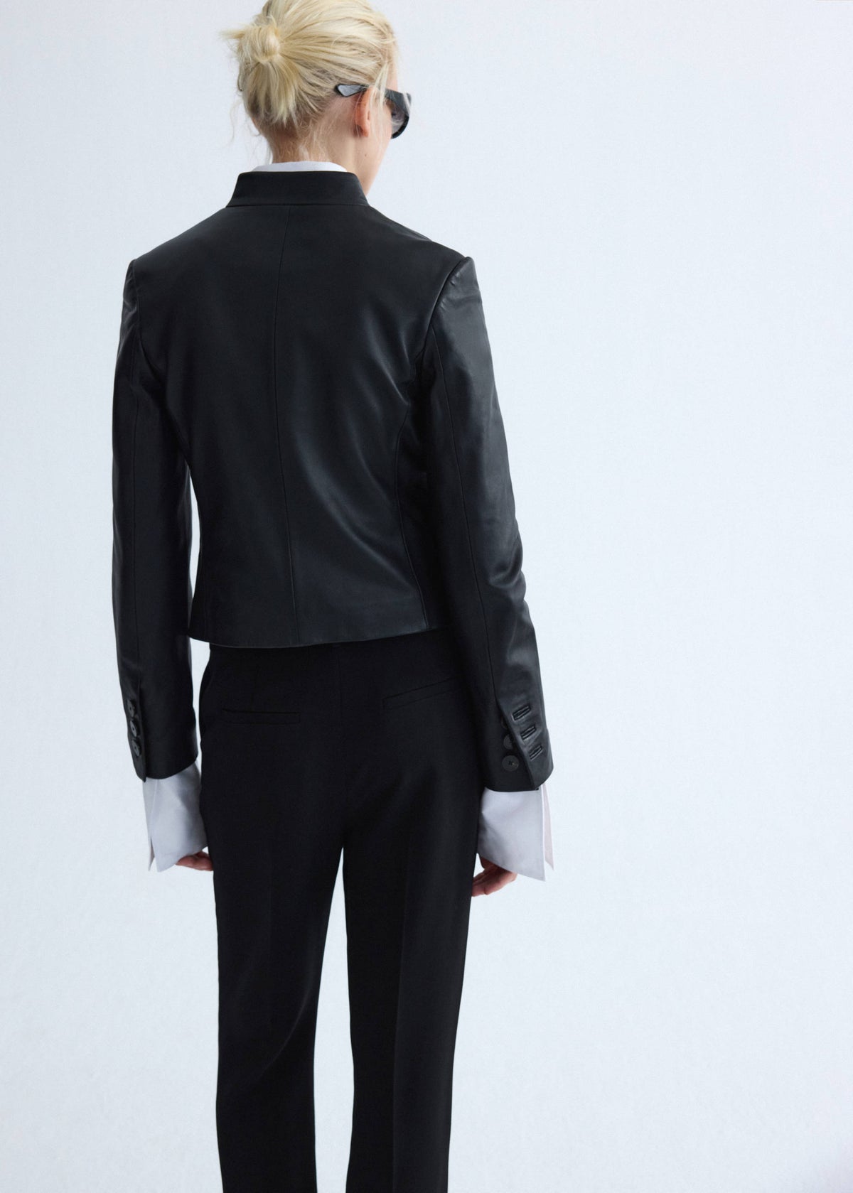 Leather jacket with strap collar