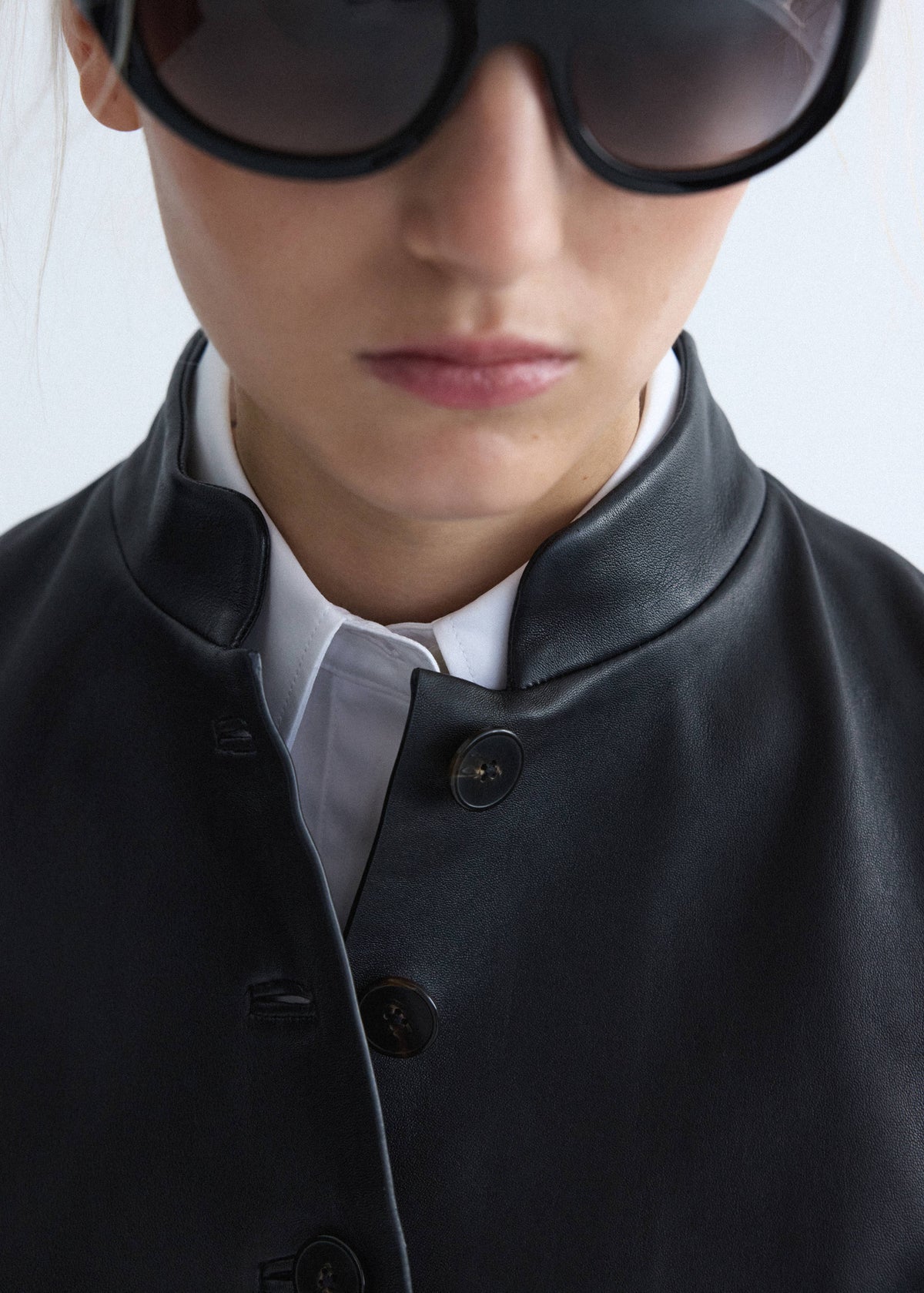 Leather jacket with strap collar