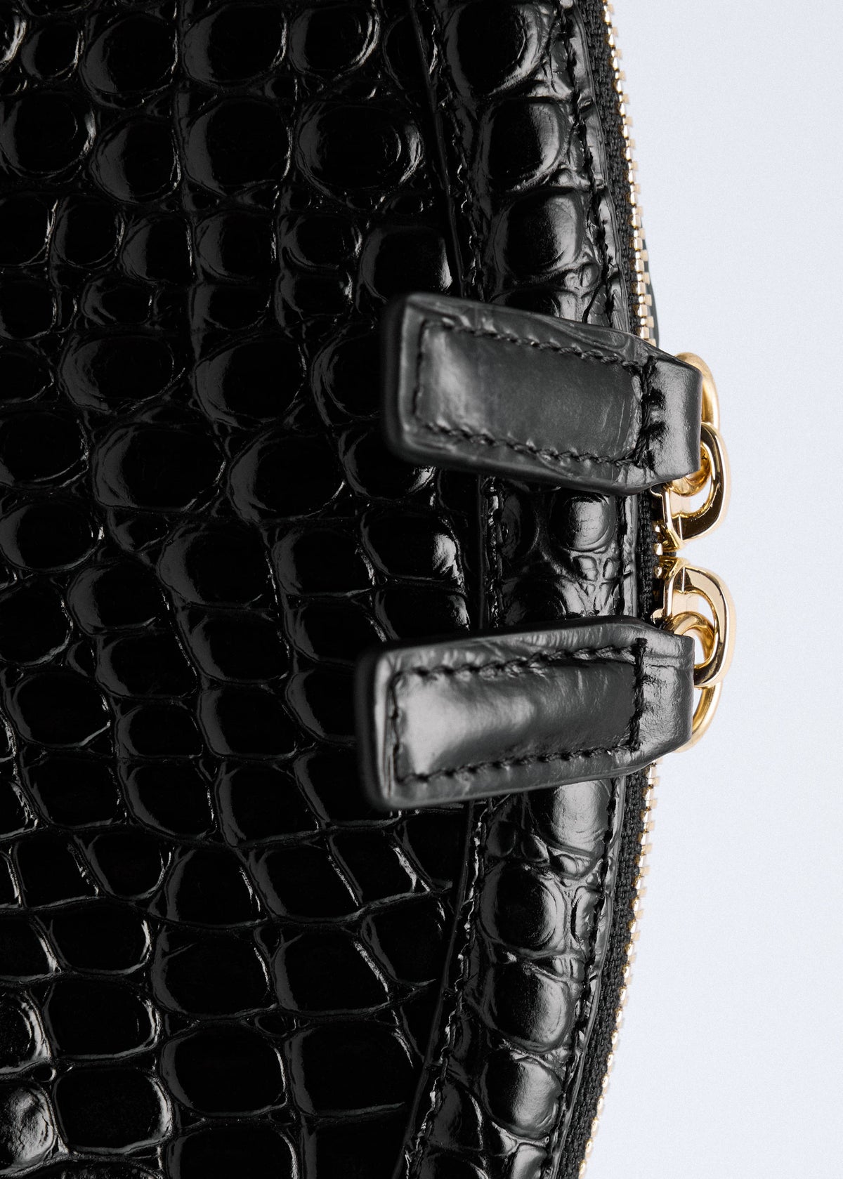 Croc-effect leather clutch bag