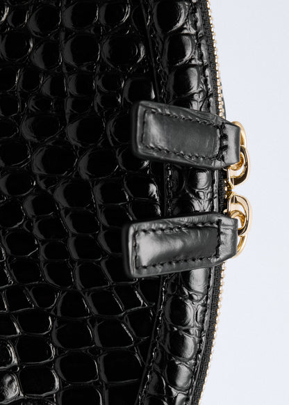 Croc-effect leather clutch bag