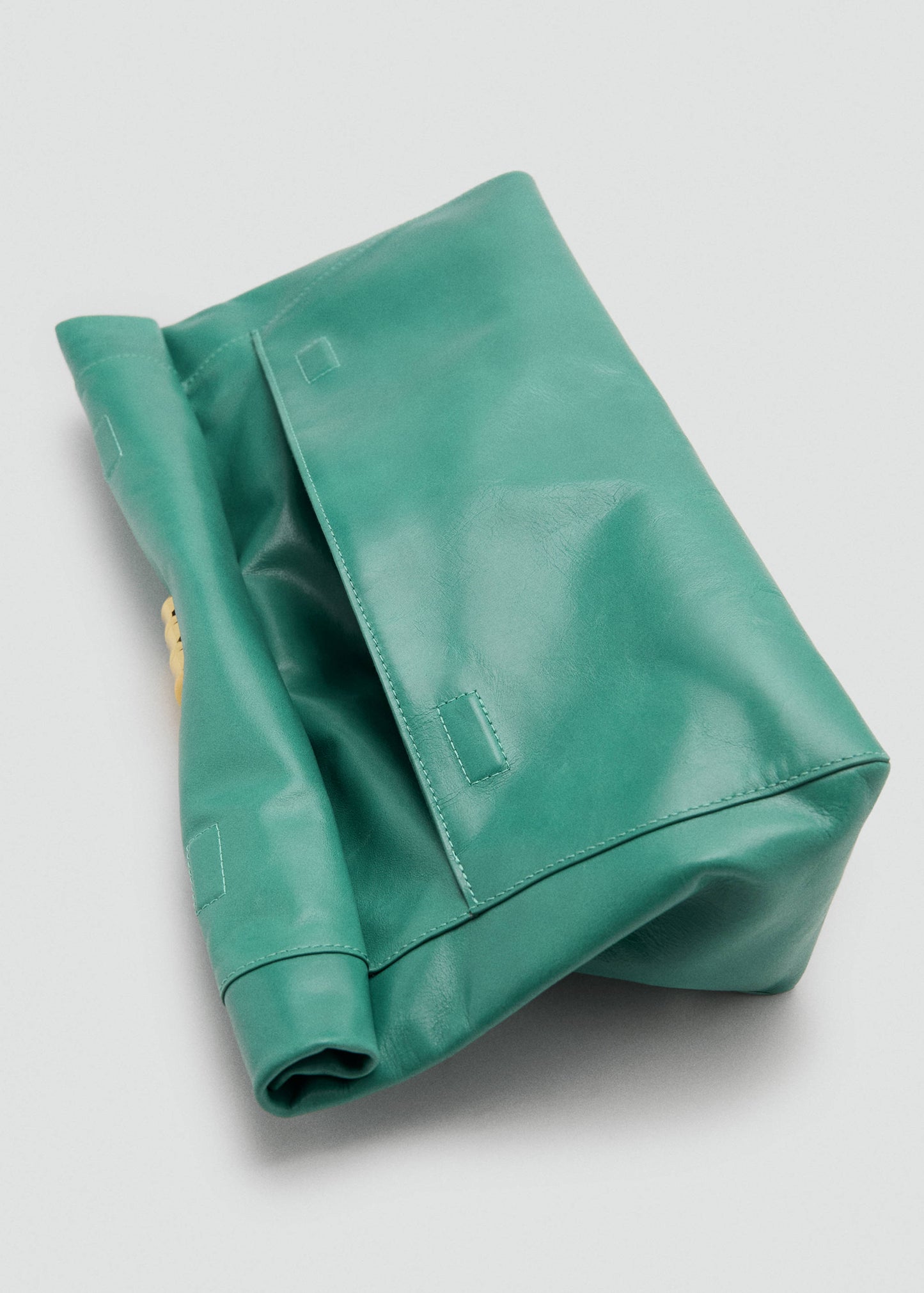 Leather clutch bag with metallic appliqué