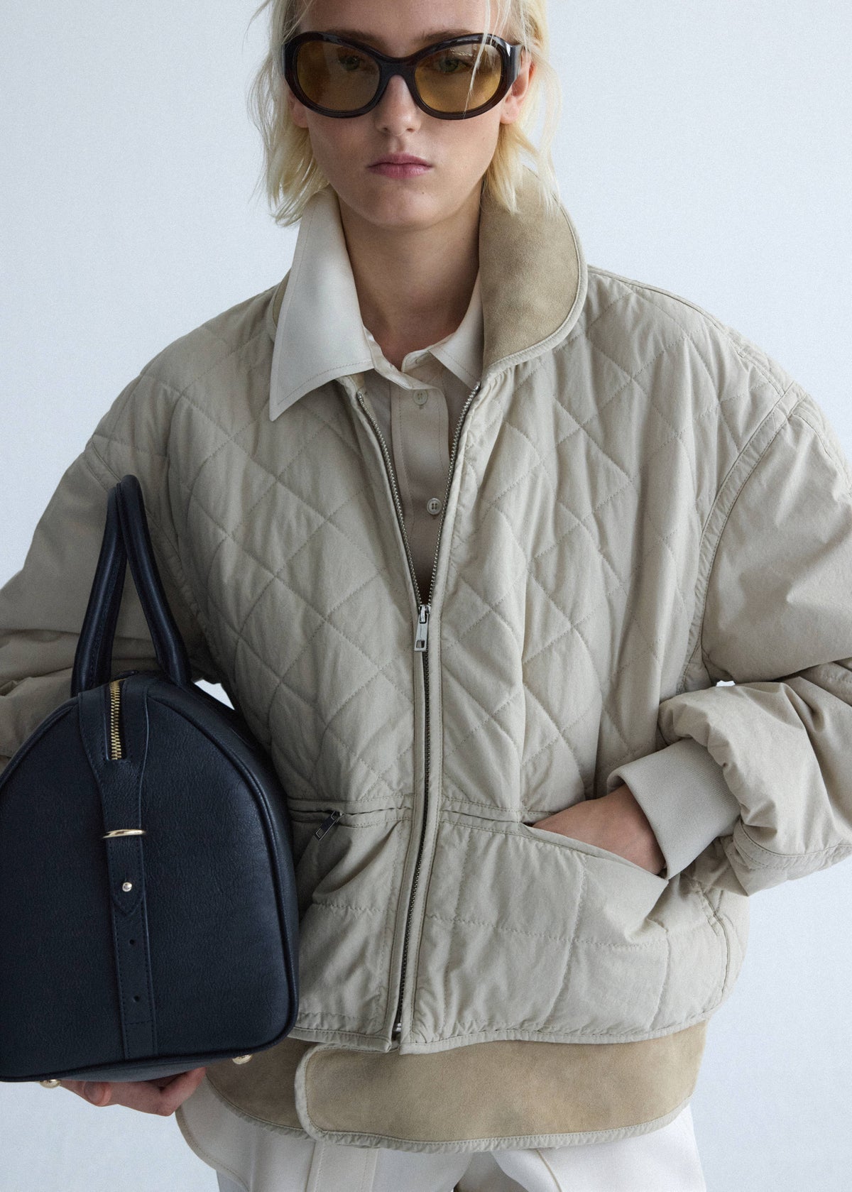 Quilted jacket with leather panels