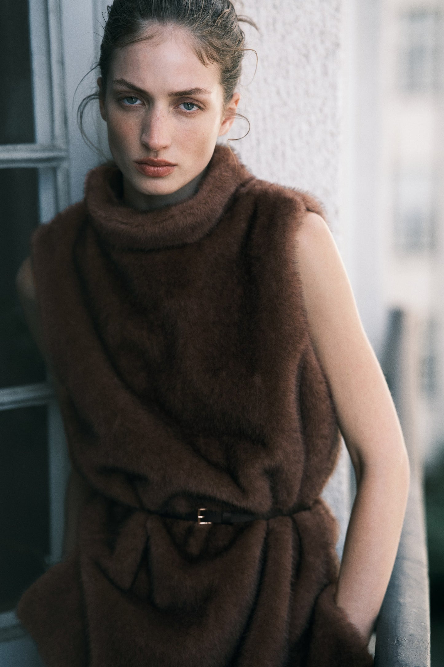Belted turtleneck top