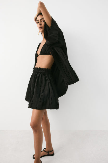 Frayed paper bag shorts