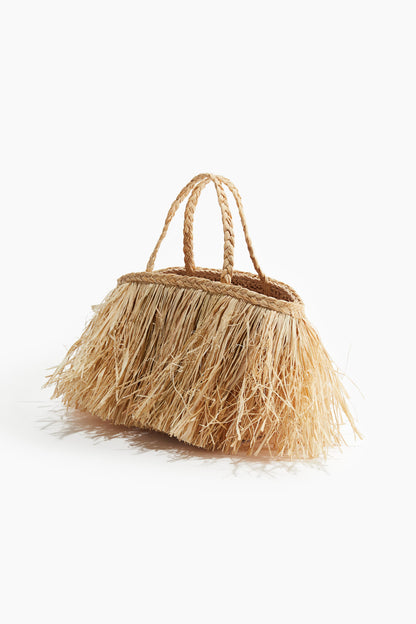 Fringed straw bag