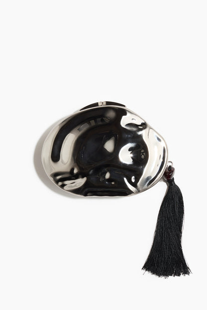 Asymmetric metal clutch