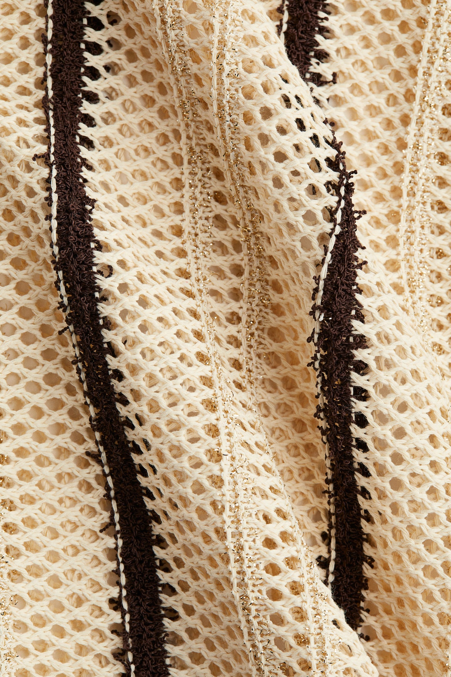 Shimmering hole-knit trousers