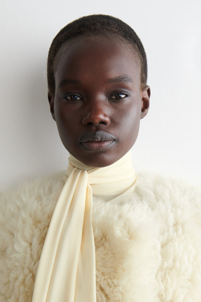 Collarless Shearling Coat