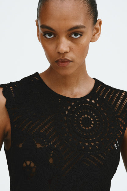 Crochet-look peplum top