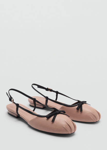 Ballet flats with decorative bow tie