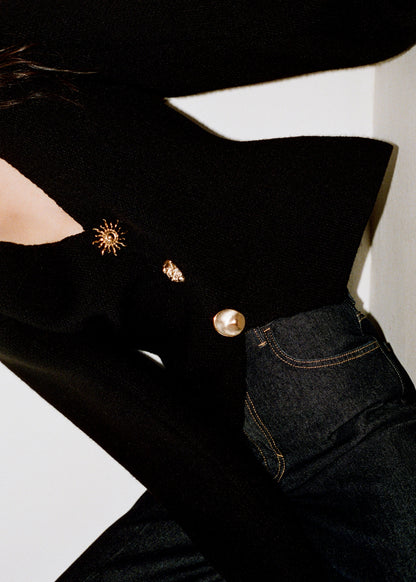 Knitted jacket with jewel buttons