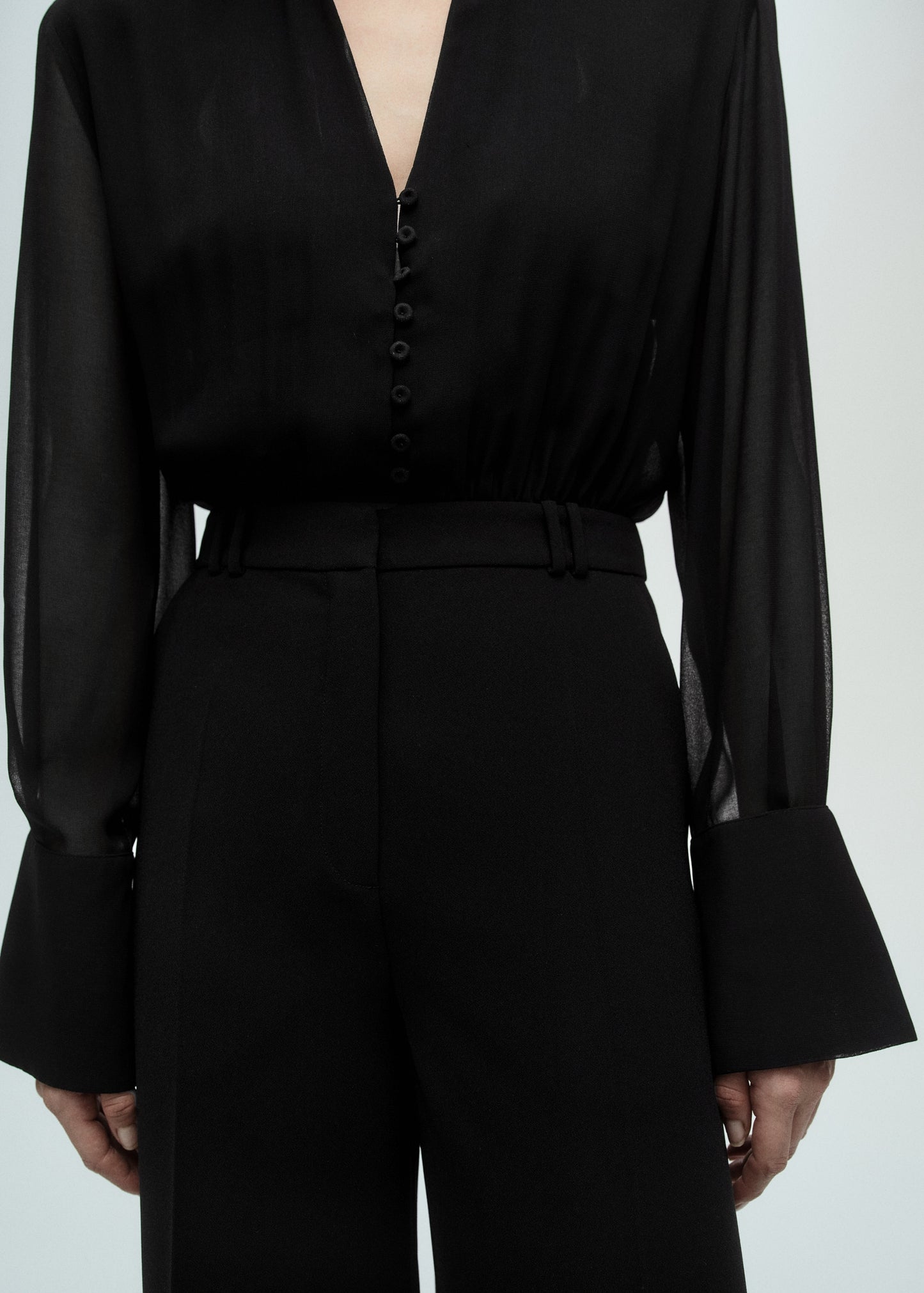 Jumpsuit with semi-transparent sleeves and belt