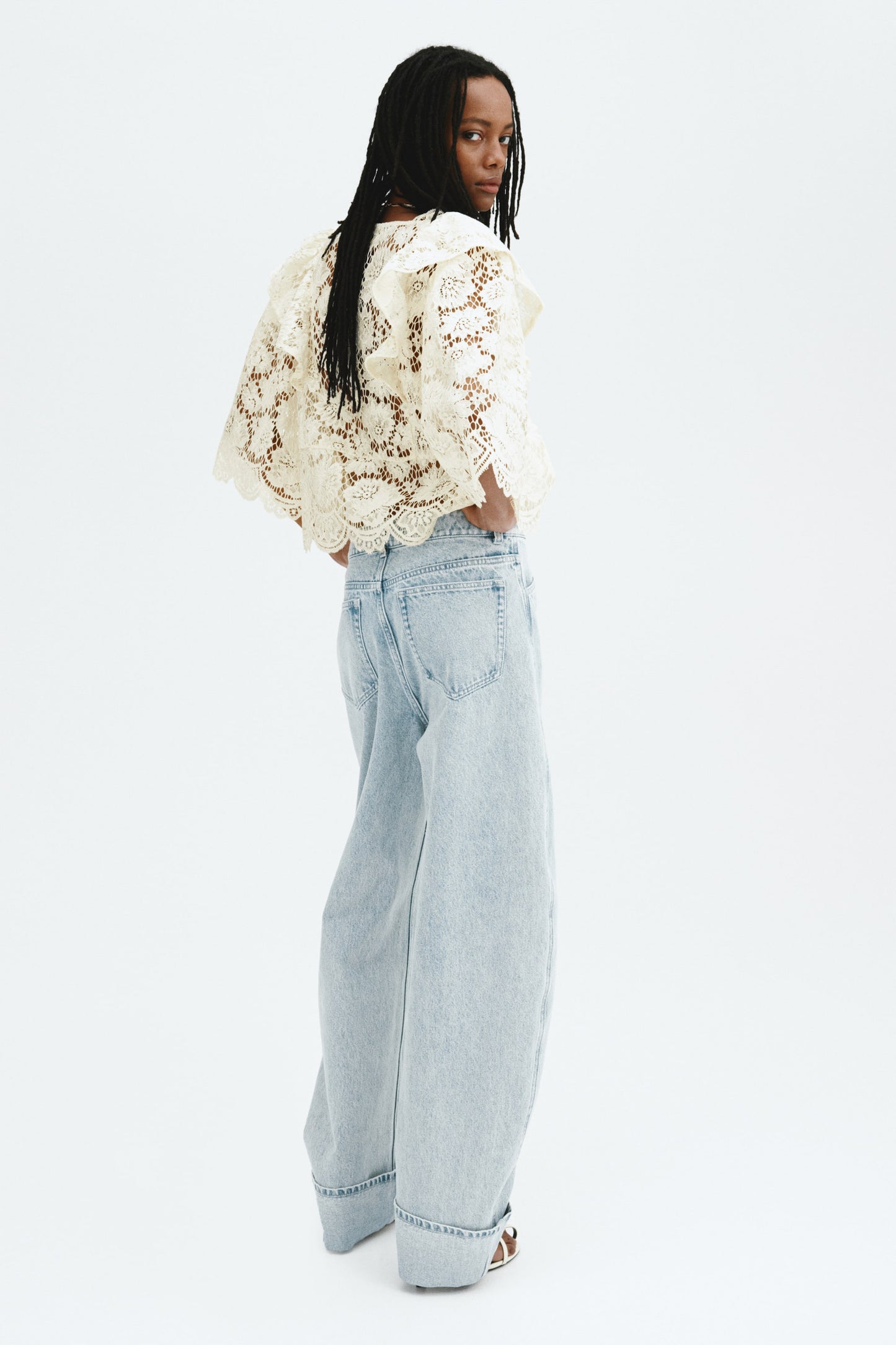 Flounce-trimmed lace blouse