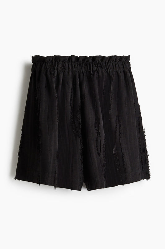 Frayed paper bag shorts