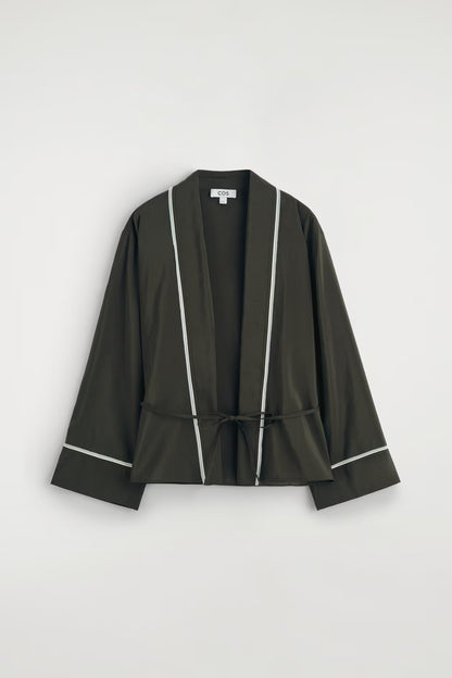 Contrast-piped belted wrap top