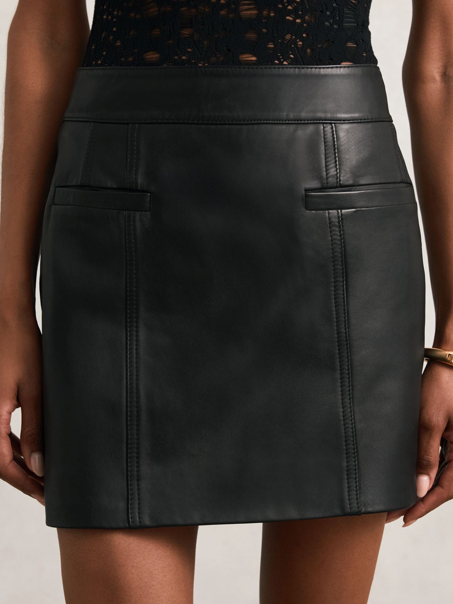 Leather Welt-Pocket Mini Skirt in Black