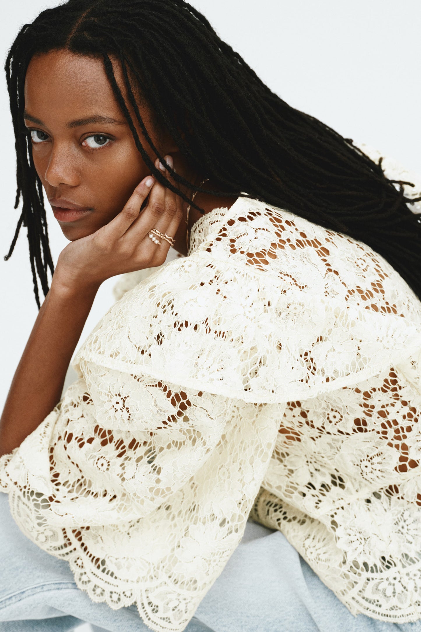 Flounce-trimmed lace blouse