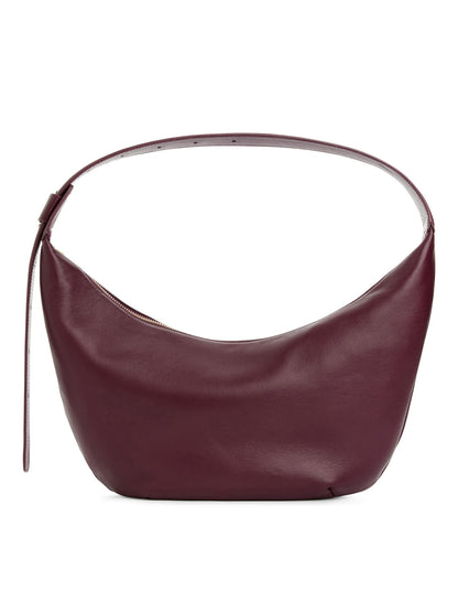 Mid size curved shoulder bag