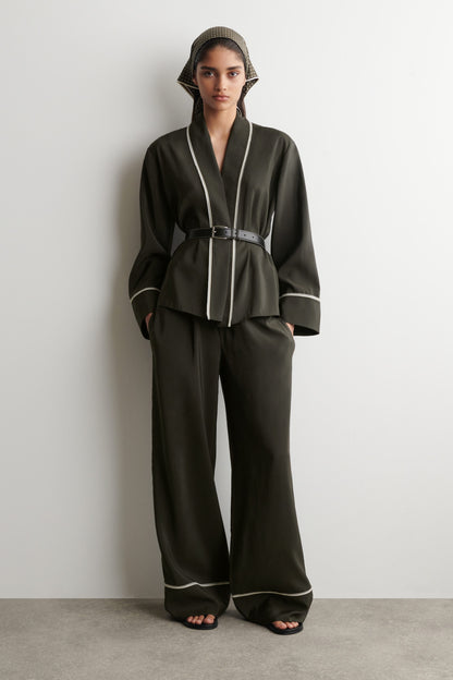 Contrast-piped belted wrap top