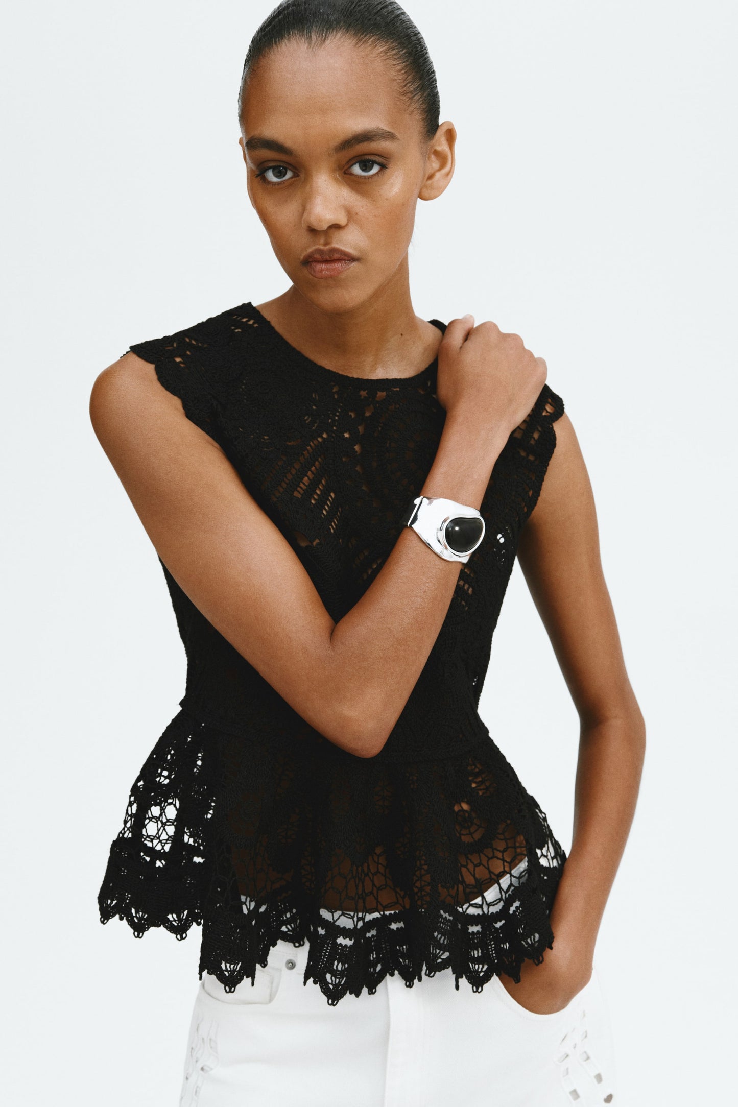 Crochet-look peplum top